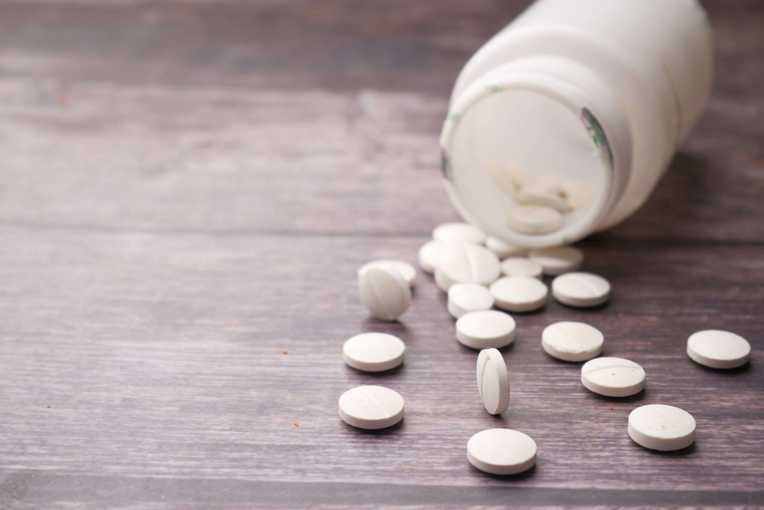 gabapentin pills spilled out on a table 