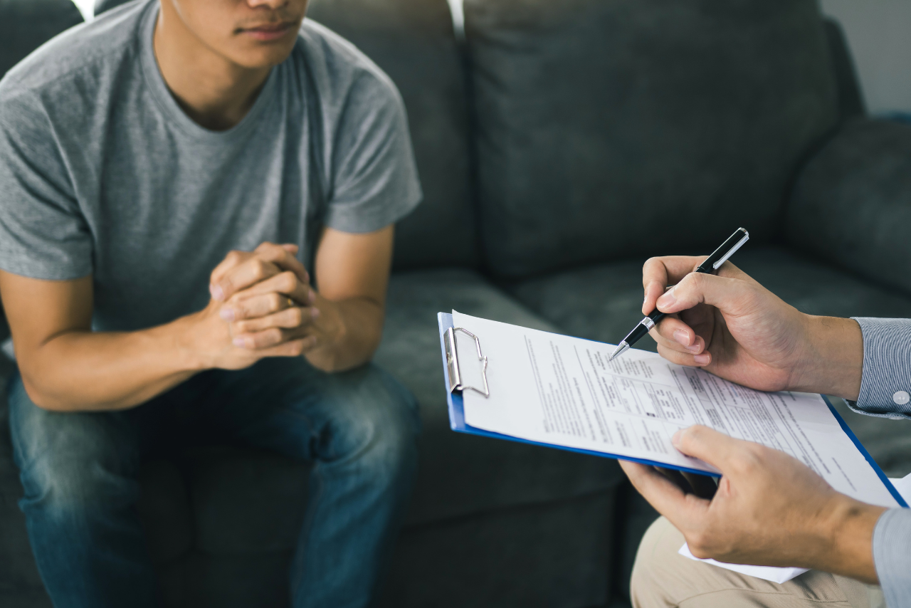 man speaking with his doctor about adderall tongue